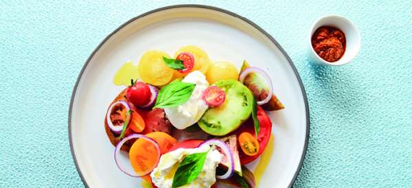 La Burrata crémeuse 300 g et pêches rôties à l’huile de mandja du restaurant Las Brisas
